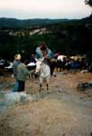 Κέρασμα έφιππων προσκυνητών στο εξωκκλήσι του Άγιου Χαράλαμπου στην τοποθεσία "Ταύρος", το ξημέρωμα. Πανηγύρι του "Ταύρου" Αγίας Παρασκευής, 1996.
